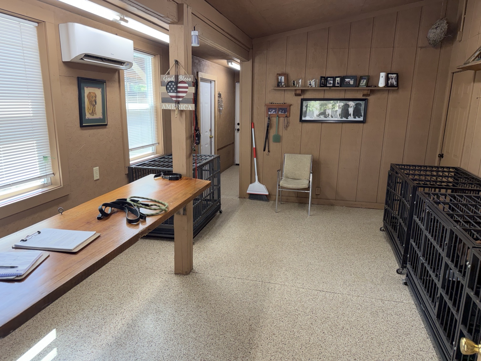 Indoor kennel room with crates and training table at Seegars Mill Kennels